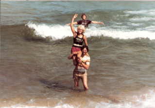 Mark Pena holds Sassy Sandi above the water of Lake Superior while Tony pretends to be the top of the Totem!